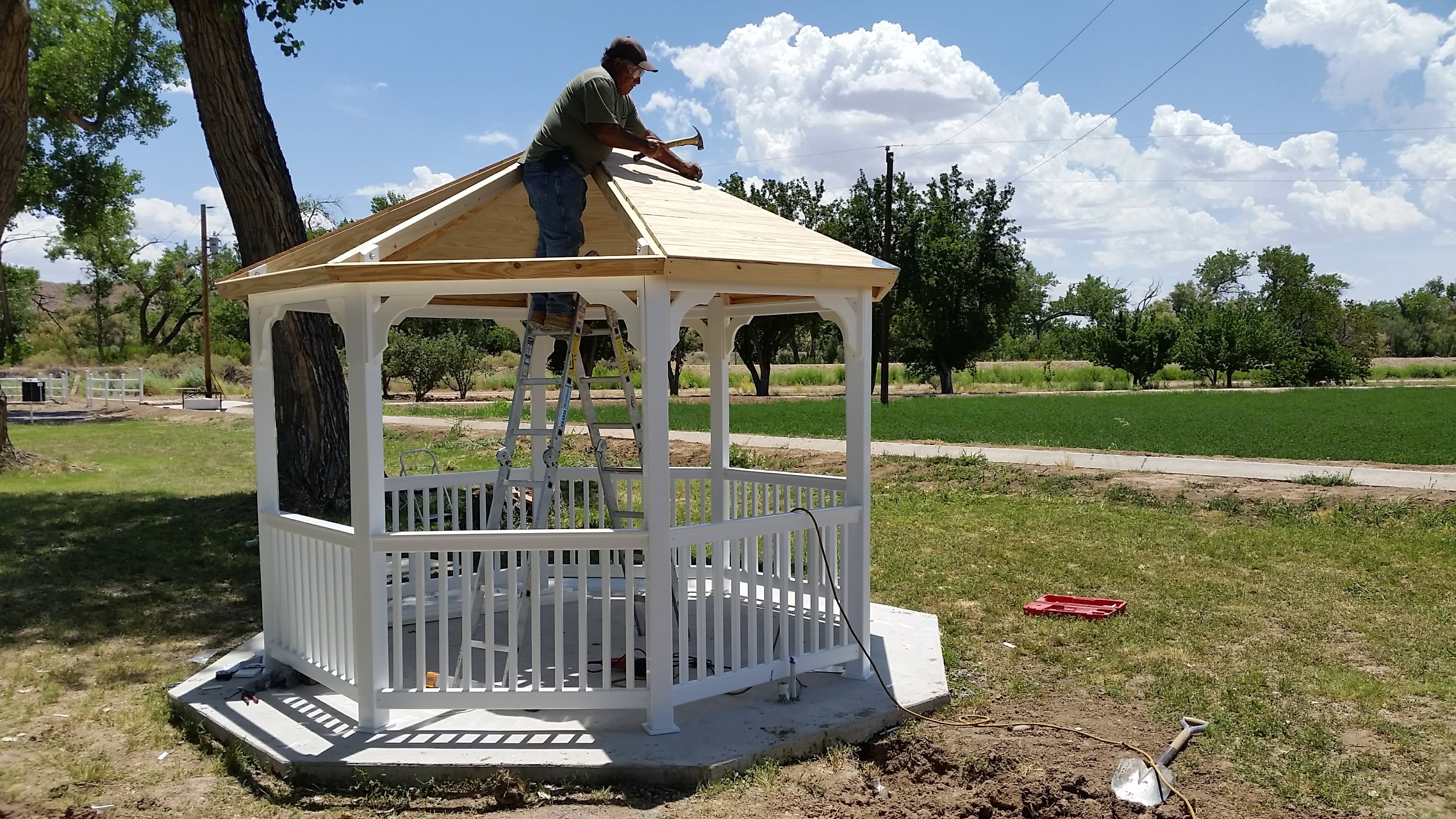 Finished white gazebo with a wood roof in New Mexico