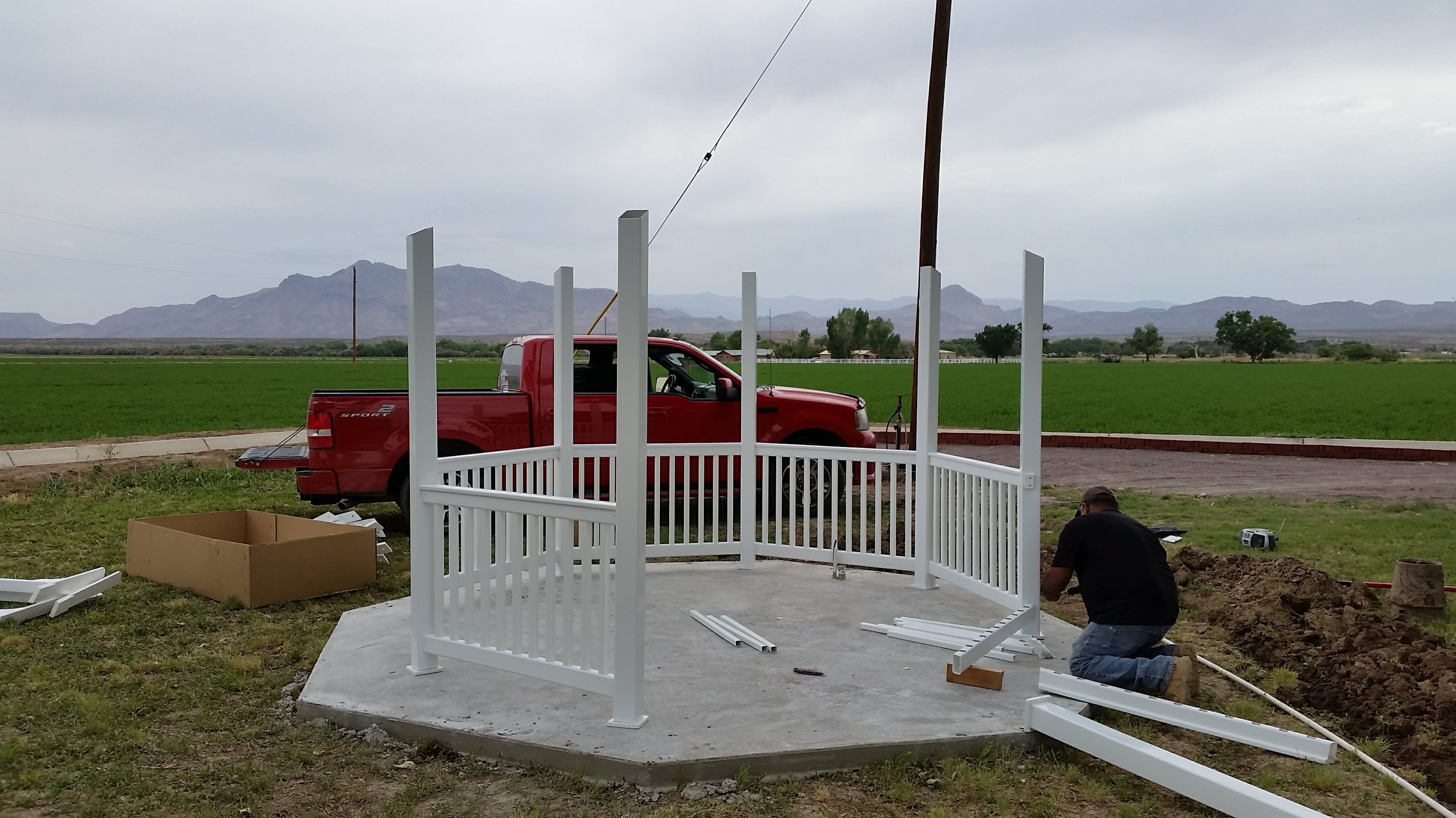 White gazebo frame being assembled in New Mexico