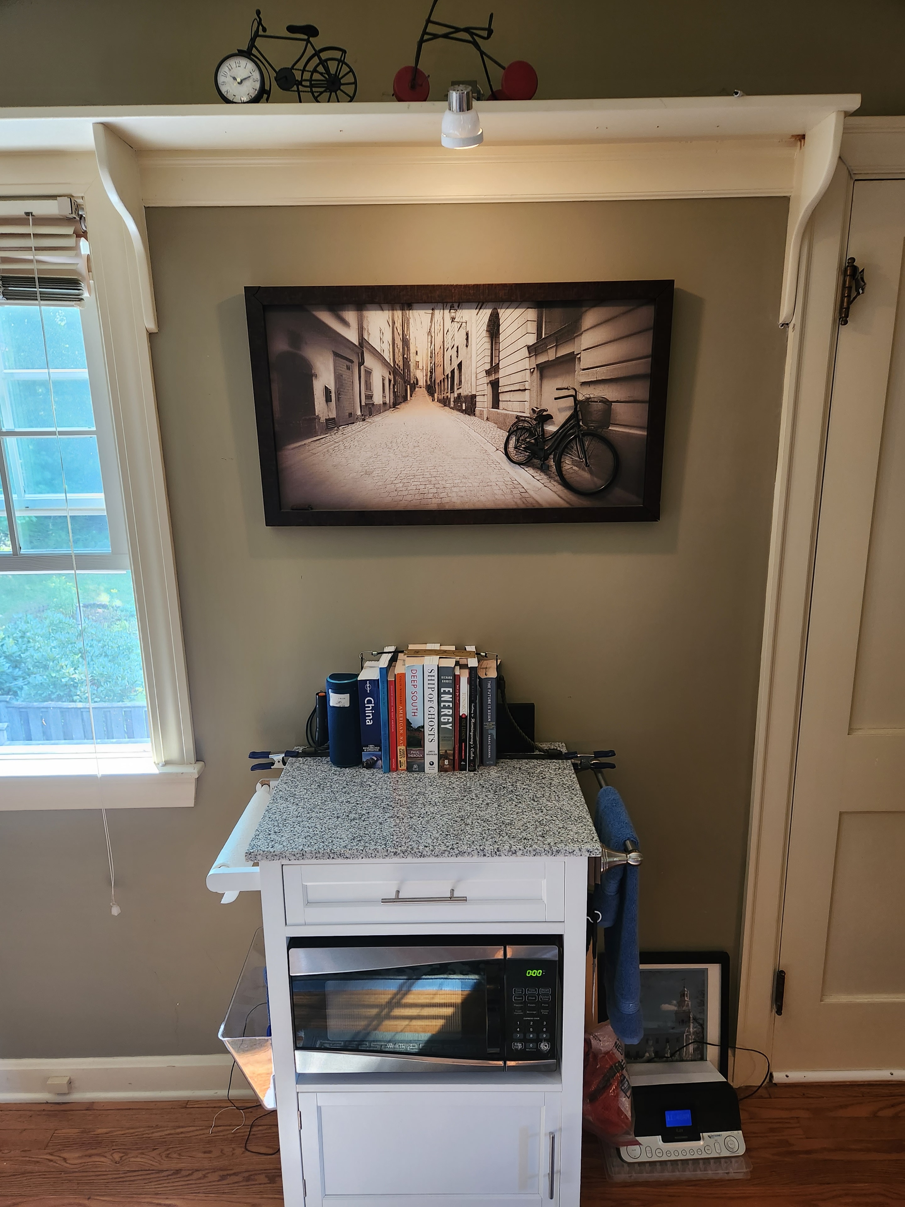 Vermont kitchen interior with framed artwork and warm finishes